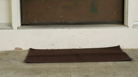 Mail Man Dropping off Package at Front Door Slider Stock Footage 81006992