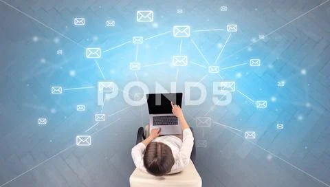 Mail symbols with woman using device Stock Photos