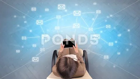 Mail symbols with woman using device Stock Photos
