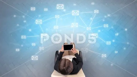 Mail symbols with woman using device Stock Photos