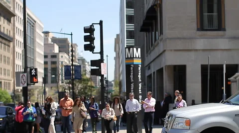 Mail Truck Pulling Away and People Crossing Street Stock Footage 46748173