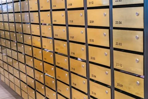 Mailbox array in postal room of apartment building Stockfoto's