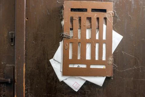 Mailbox full of letters on the door Stock Photos