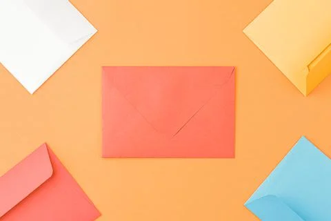 Mailing envelopes on orange background. Stock Photos
