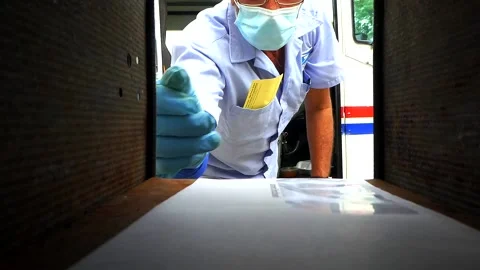 Mailman Putting a Letter Inside a Mailbox 库存影片 130884070
