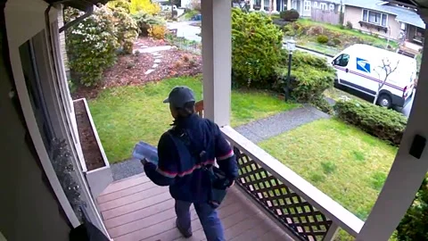 Mailman Runs as Dog Bursts Through Window, Tacoma, Washington, USA - 11 Apr 2019 Stock Footage 205225204