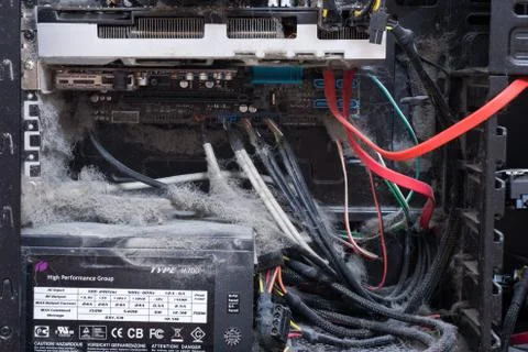 The main components of the outdated, dusty and non-working computer, supply and Stock Photos