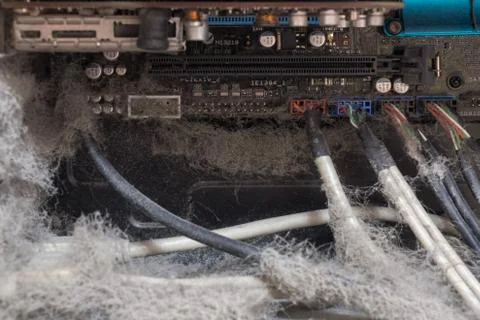 The main components of the outdated, dusty and non-working computer, supply and Foto stock