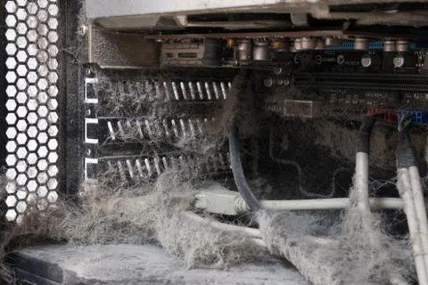 The main components of the outdated, dusty and non-working computer, supply and Foto stock