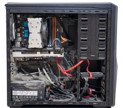 The main components of the outdated, dusty and non-working computer, supply and Foto stock