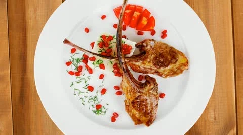 Main course: grilled ribs with rice and tomatoes on white plate Vídeos de archivo 21362817