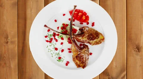 Main course: grilled ribs with rice and tomatoes 動画素材 24409997