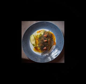 Main Course Wild Caught Fish Bush Food Matted In Black Stock Photos