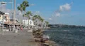Main embankment in Paphos harbor with walking people HD Footage
