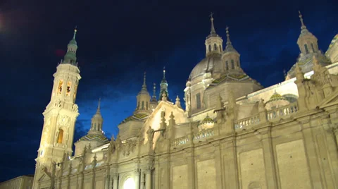 Main facade, domes and towers of Basilica at night, pan Stock Footage 39325894