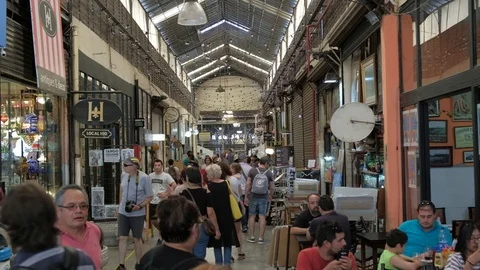 The main hall of San Telmo Fair full of tourists shopping antiques. DOLLY IN Stock-Footage 122600543