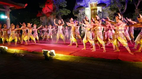 Main hero raised up on hands of many people, balinese performance show Stock Footage 52453736