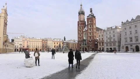 Main Market Square under snow. St. Mary`s basilica (Kosciol Mariacki). 4585 Stock Footage 147455089