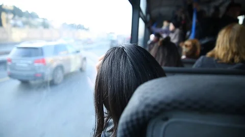 The main mass transit passengers in the bus. People in old public bus, view from Stock Footage 129037429