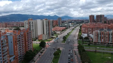 Main road between residential buildings with cars and bikecycles	 Stock Footage 157690806