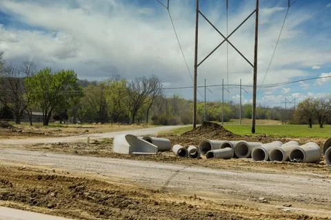 Main road construction drainage system on concrete manholes are installed at  Stock Photos