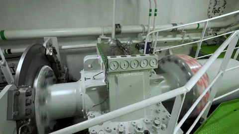 Main shaft with braking system rotates in motor room of vessel. Shaft from Stock Footage 260265829