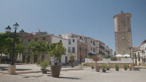 Main square and the historic clock tower in Iznatoraf, Jaén (Spain). Stock Footage 342574626