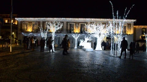 Main Square of Cascais covered in bright illuminated Christmas lights and Stock Footage 99145932