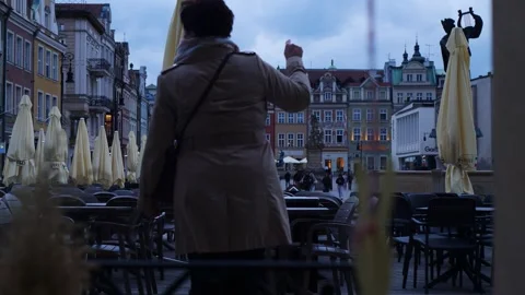 The main square at dusk as seen from the window of a restaurant Stock Footage 334639088