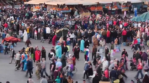 Main square in Marrakesh of Morocco smooth zoom time lapse Stock Footage 76392648