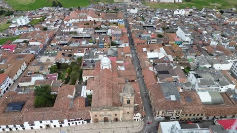 Main square of Tunja Colombia, Colonial park with historic buildings, Aerial Stock Footage 319864283