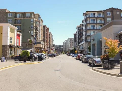 Main street of Point Ruston flanked by modern residential apartment complex.. Stock Photos