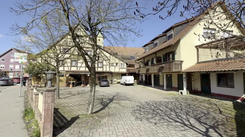 The main street through Schliengen, featuring a half-timbered house Stock Footage 336097341