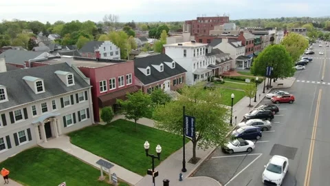 Main Street USA, small town America, aerial establishing shot of traffic Stock Footage