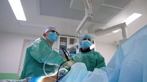 Main surgeon uses laparoscopic device moving it slowly Stock Footage 251764253