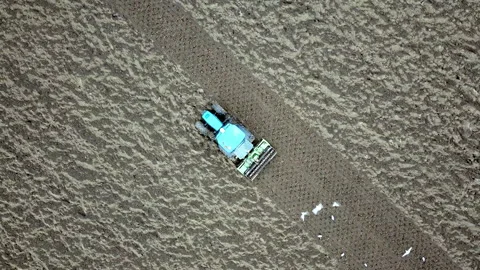 Main tillage tractor with an implement with rotating parts that break the soils Stock Footage 167293243