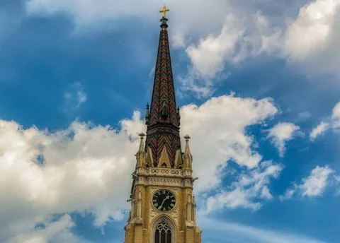 Main tower with clock at catholic Cathedral in Novi Sad, Serbia. Stock Photos