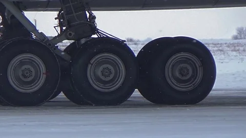 The main wheels steering the plane Stock Footage 72664900