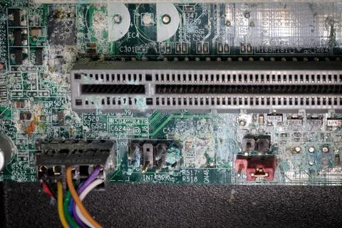 A mainboard of a computer is corroded due to water penetration Stock Photos