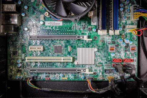 A mainboard of a computer is corroded due to water penetration Stock Photos