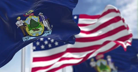 Maine state flags waving along with the national flag of the US Video stock 196823347