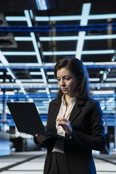 Mainframes maintenance, laptop software and system administrator in data center Stock Photos