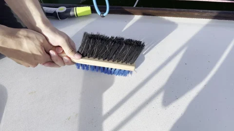 Maintain your boats deck by using a brush for cleaning Stock Footage 278283091