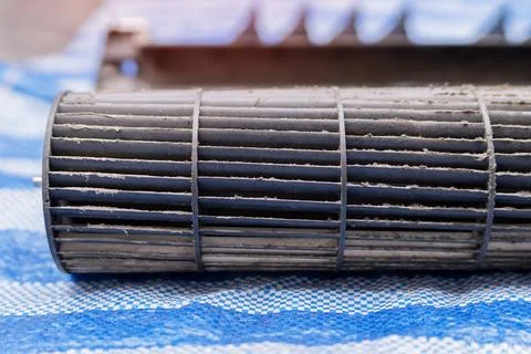 Maintaining Air Conditioning Unit by Replacing Dirty fan wheel. Close-up. Stock Photos