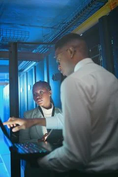 Maintenance, analysis or team in server room with laptop, network or system Stock Photos