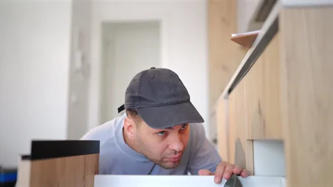 Maintenance and toolbox with handyman in kitchen of home for repair work. 스톡 동영상 342948899