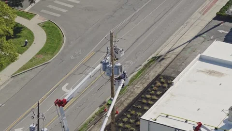 Maintenance construction crew repairing power grid bringing electricity online Stock Footage 343659363