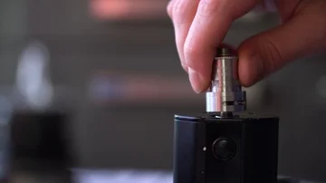 Maintenance of electronic fur modem. Master of repair of the evaporator.man puts Stock-Footage 85994043