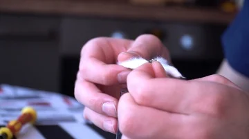 Maintenance of electronic mech mod vaping device.Master repairs vaporizer.Specia Stock Footage 85993625