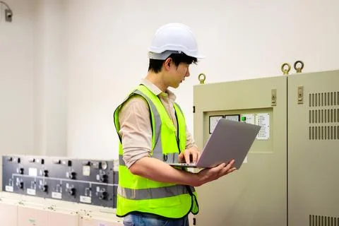 Maintenance engineer installing solar panels on solar cell farm Stock Photos